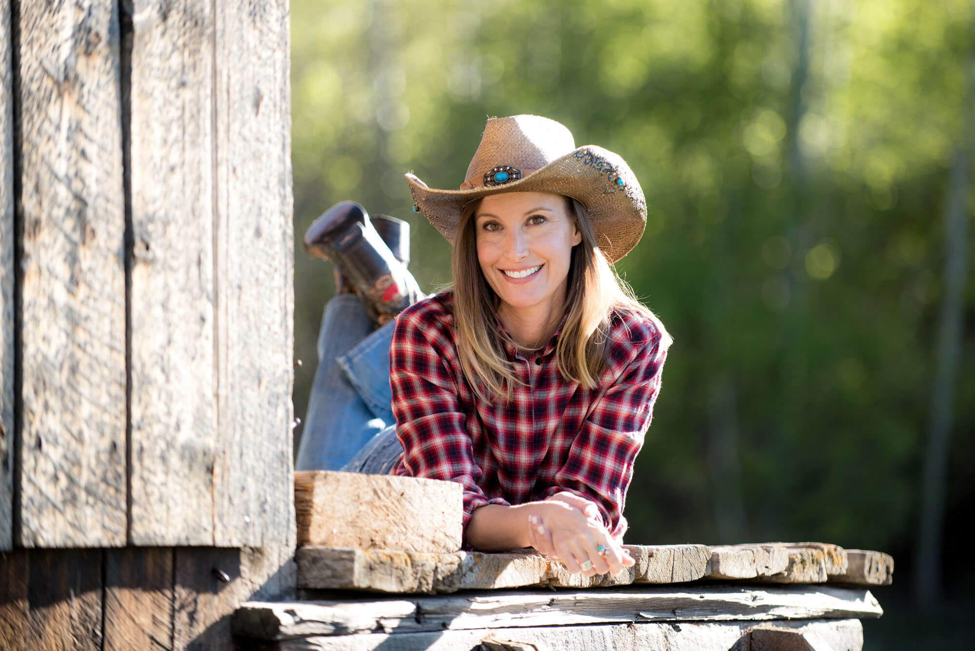 lifestyle headshot of a women in cowboy hat
