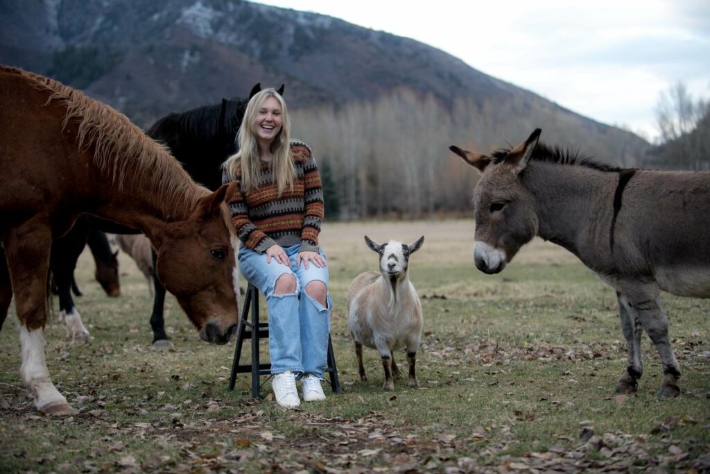 Unsual senior portrait with farm animals